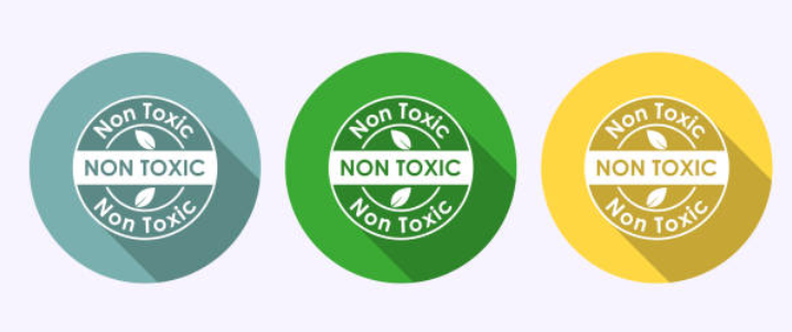 Three circular non-toxic product labels in blue, green, and yellow.