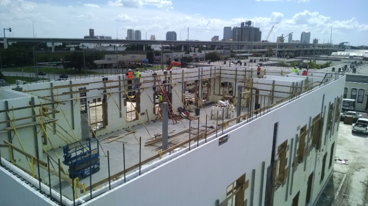 Building under construction using insulated concrete form blocks with visible wall system.