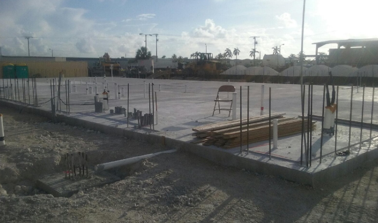 Insulated concrete form foundation slab with vertical rebar and plumbing rough-ins.