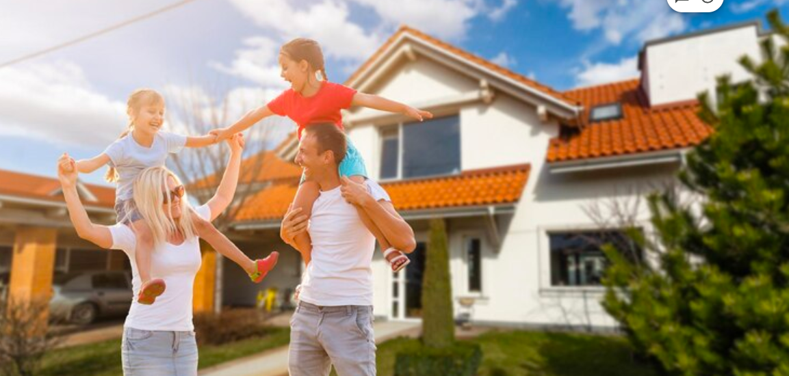 Family standing outside a modern ICF home highlighting insurance benefits and home durability.