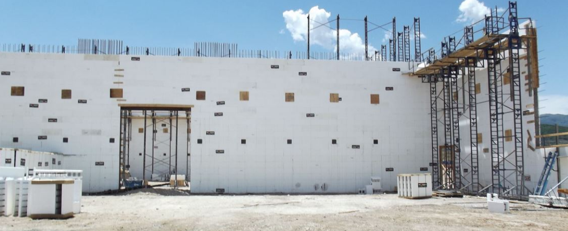 Insulated concrete form (ICF) walls under construction with bracing and reinforcement in place before concrete placement.