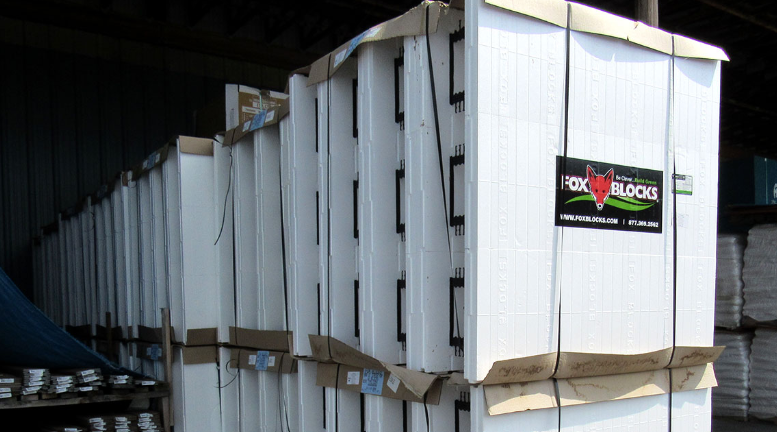 A shipment of Fox Blocks ICF stored at a construction site warehouse.