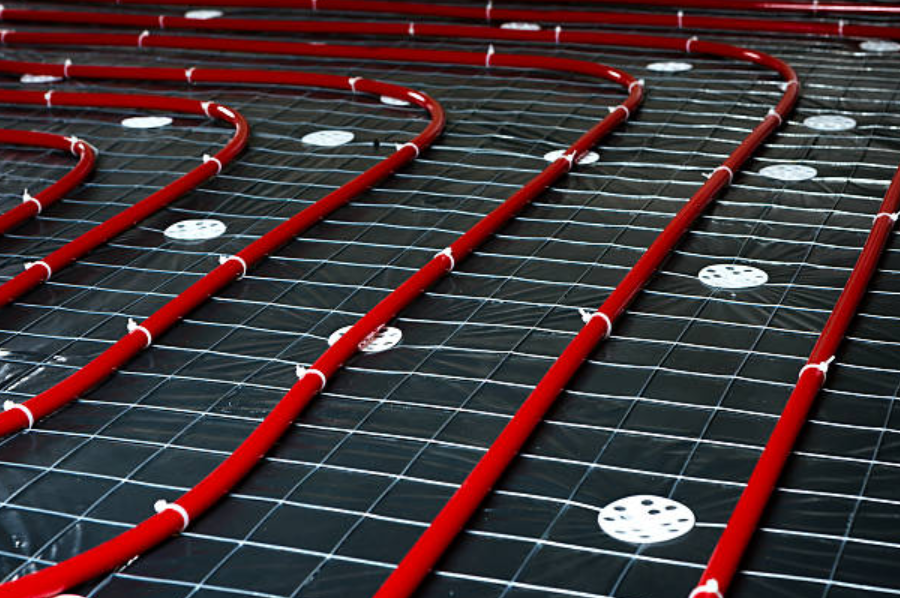 Radiant floor heating installation inside an ICF-built home.