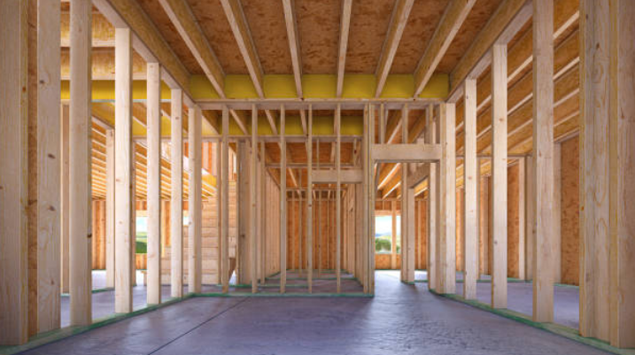 Interior wood framing of a new home during housing construction.