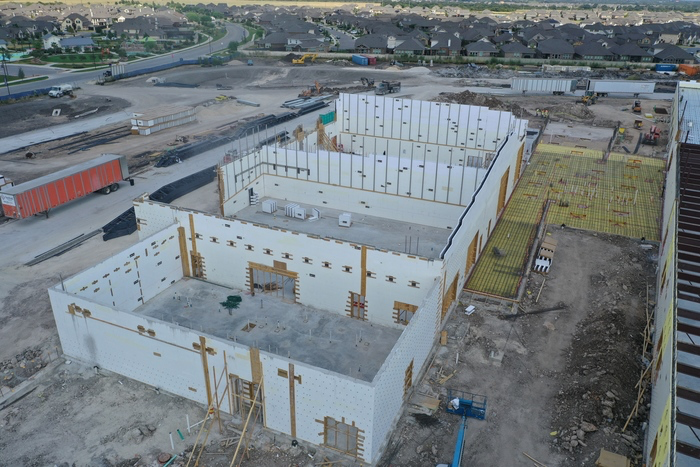 A photo of a building being constructed with concrete form insulation